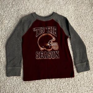 boys football shirt. grey and red. size 6/7.